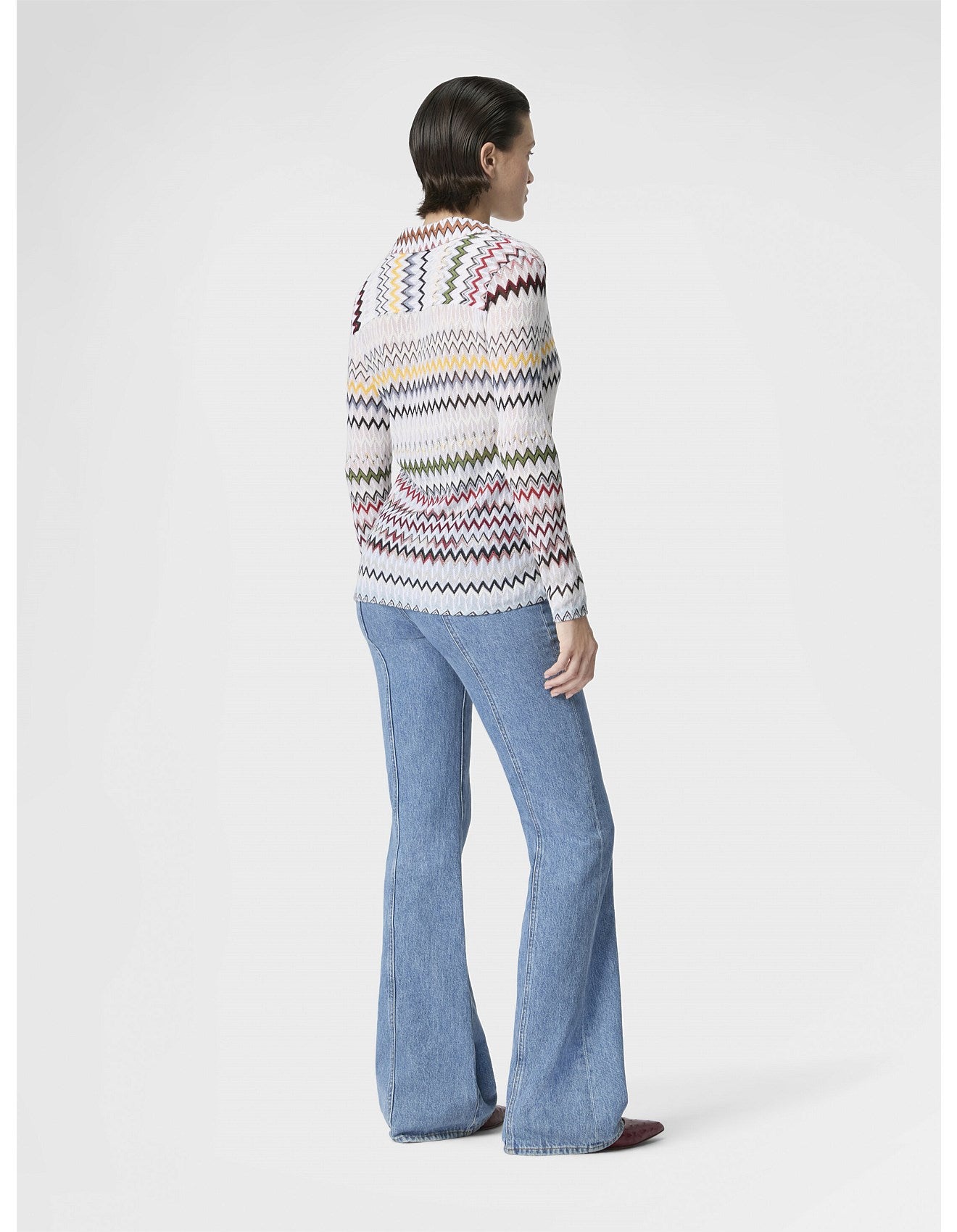 Missoni women's V-neck blouse in cotton and viscose blend. Raschel knit with signature micro zigzag lace motif. 