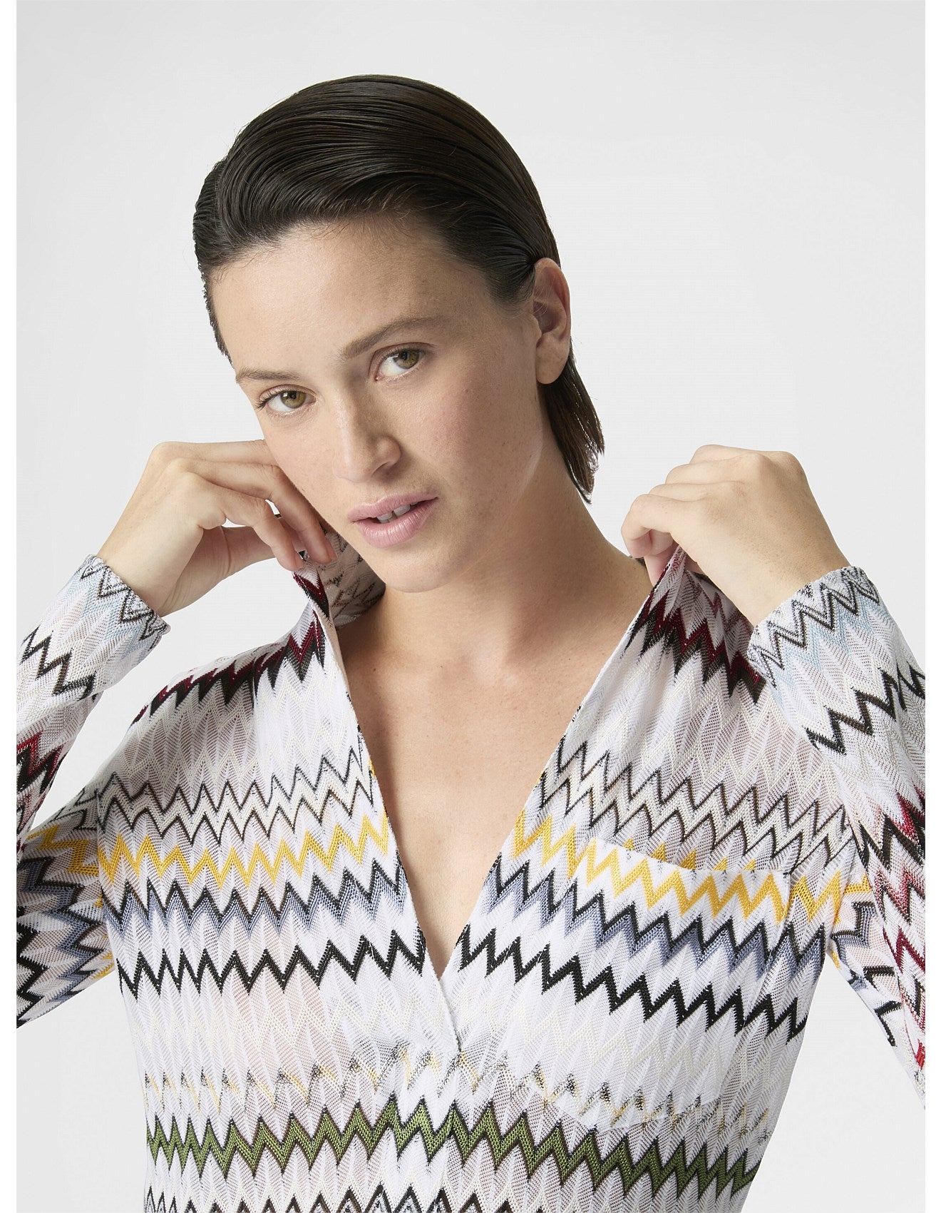 Missoni women's V-neck blouse in cotton and viscose blend. Raschel knit with signature micro zigzag lace motif. 