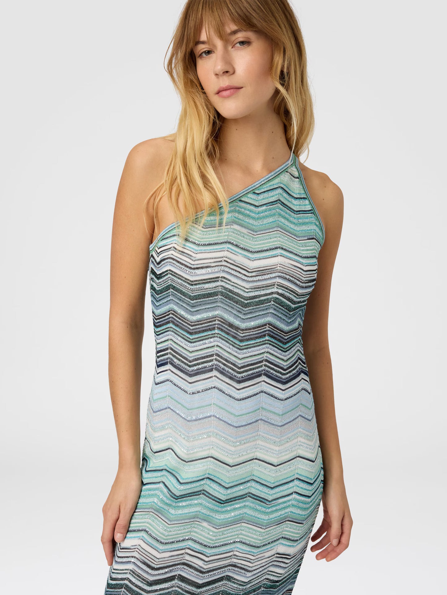 Woman wearing One shoulder turquoise Missoni zigzag patterned dress 